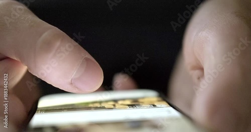 Man flipping through mobile phone. High quality 4k footage