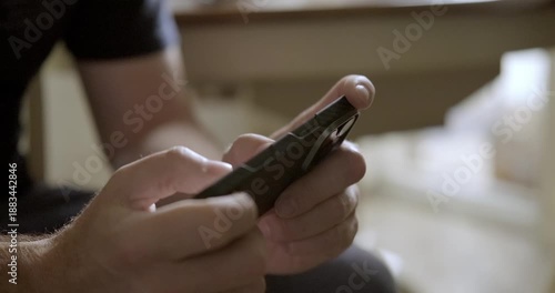 Man playing mobile phone close-up. High quality 4k footage