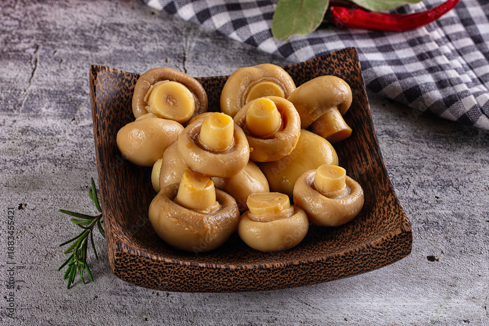 Fototapeta premium Marinated pickled champignon in the bowl