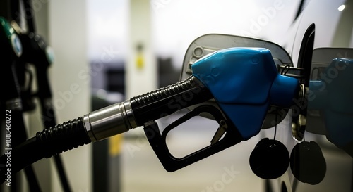 Wallpaper Mural Close up of a gas pump nozzle filling a vehicle's tank at a fuel station Torontodigital.ca