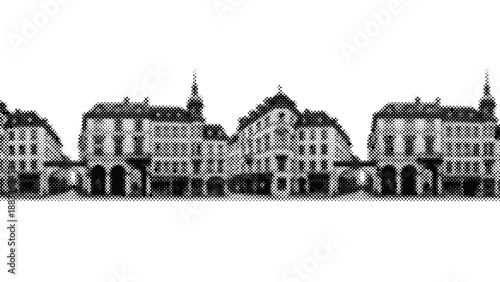 row of old european buildings with steeply pitched roofs and arched doorways in one line