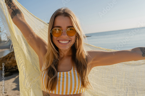 pretty happy young woman having fun on summer beach vacation
