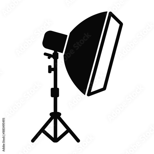 Studio light with softbox on tripod stands ready for action.