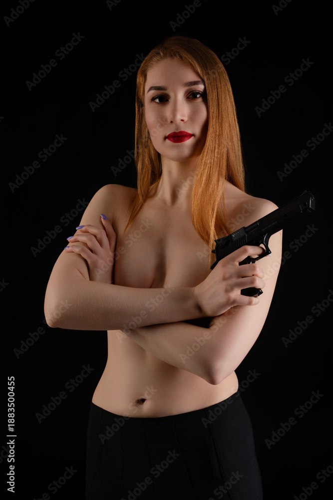 custom made wallpaper toronto digitalConfident woman holding a pistol in a dramatic dark setting