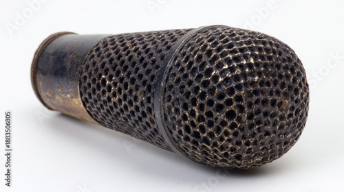 singer. A classic microphone with vintage design, showcased against a plain white background from a top-down perspective. product launch decks.
