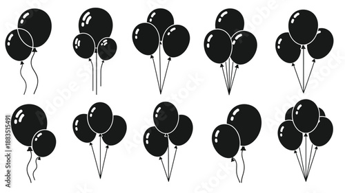 a collection of black balloons with strings arranged in various groupings