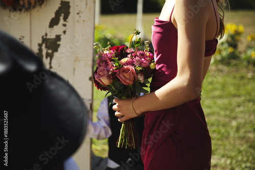 Wallpaper Mural A woman holding a bouquet at a wedding. Torontodigital.ca