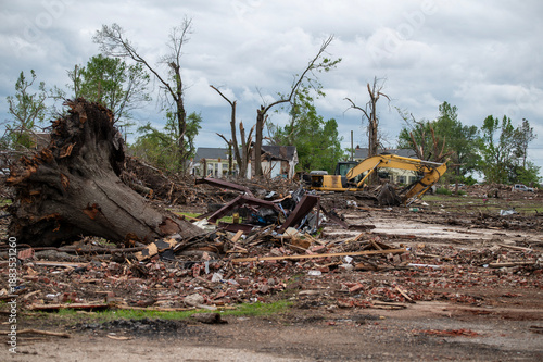 Фотография Tornado demolished neighborhood debris removal in Rolling Fork