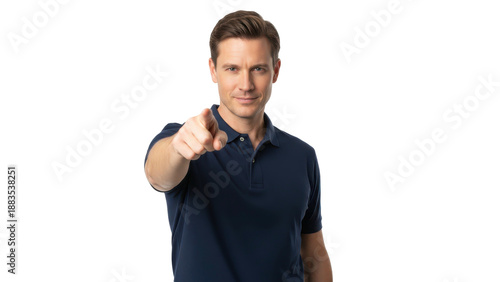 Confident handsome man in a dark blue polo shirt pointing his finger at you.