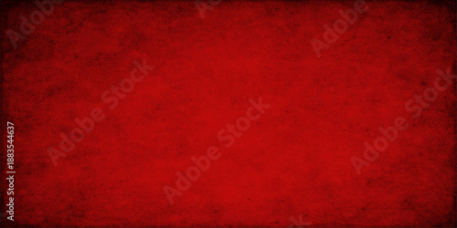 Red grunge background with copy space features an aged vintage paper texture and dark textured canvas material for a blank antique wallpaper design
