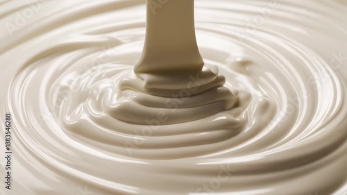 Thick White Cream Stream Flowing into Endless Cream Pool, Close-Up Food Texture Background