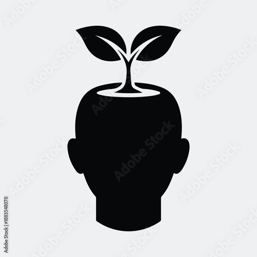 Growing plant sprouts from silhouette human head symbolizing new ideas