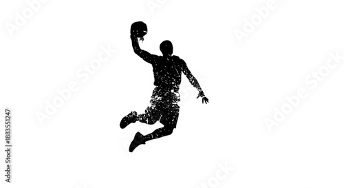 Silhouette of a basketball player in mid-air dunking.