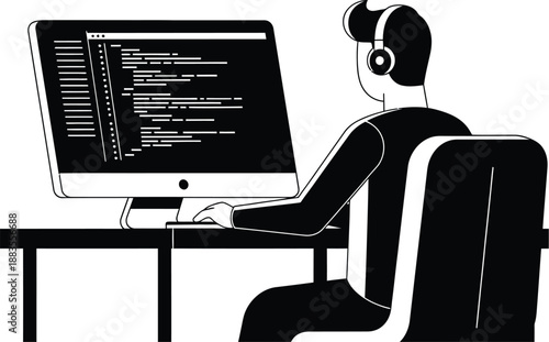 Programmer sitting at desk wearing headphones, intently typing source code on a large computer monitor in a darkened.