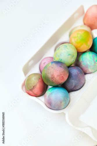 Easter painted eggs folded in plastic container
