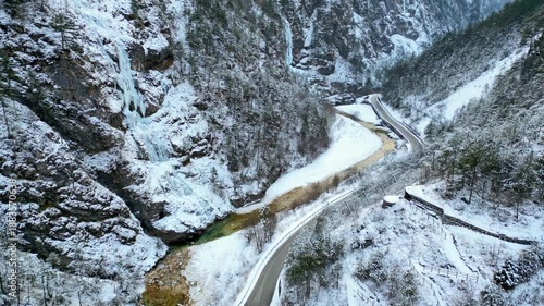 Raccolana Valley and the Repepeit waterfall in the snow in winter. 