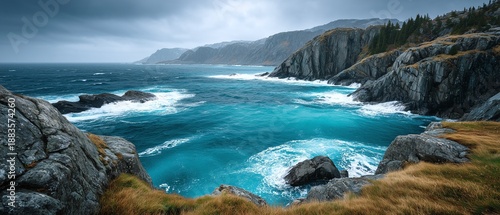 Rugged ocean coastline with wild turquoise waves crashing against rocky cliffs