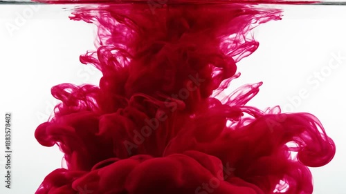 Red Ink in Water: Dynamic swirls of crimson ink dance and bloom in the clear water, creating a stunning visual display of liquid art, the movement is captured perfectly.