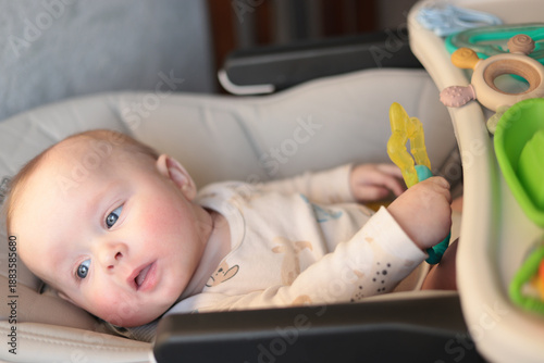 Infant Watching Object With Calm Repose, Reclining Baby Focuses On Nearby Object Peacefully During Feeding