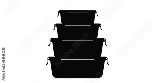 a stack of four black rectangular containers with lids neatly arranged and silhouetted
