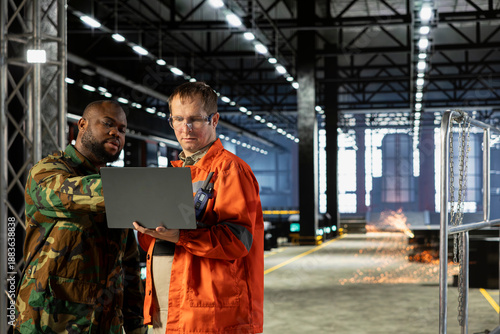 Photos Diverse military officer and staff managing production adapted for armament manufacturing, industrial mobilization supports the wartime economy through precision and national resilience