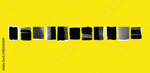 A row of black and silver tubes on a yellow surface viewed from directly above