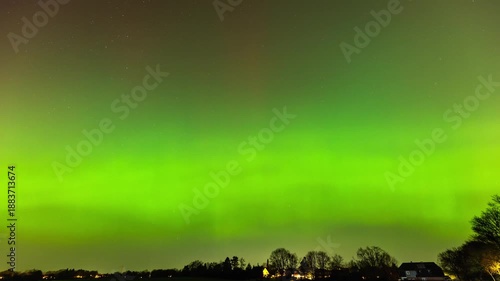 A spectacular time lapse sequence of the Aurora Borealis (Northern Lights) illuminating the night sky near Hamburg, Germany. 
The long-exposure photograph captures intense shades of green and rare red