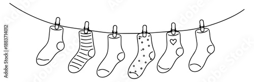 Hand drawn line art socks set featuring various patterned and plain socks on a clothesline for laundry concepts