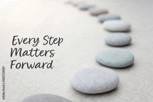 Row of Smooth Grey Pebbles on a Textured Surface