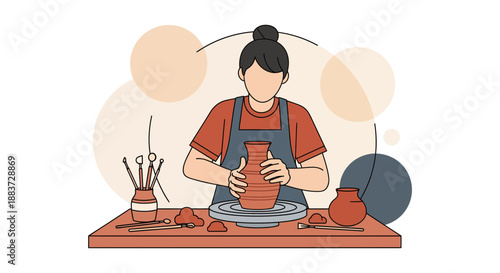 Young woman shaping clay on pottery wheel.