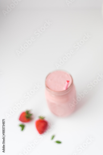 Strawberry smoothies in glasses on white background