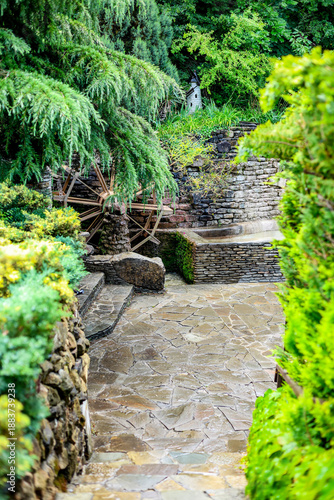 The photograph shows a wheel as a decorative element located in the park in the village of Kabardinka.