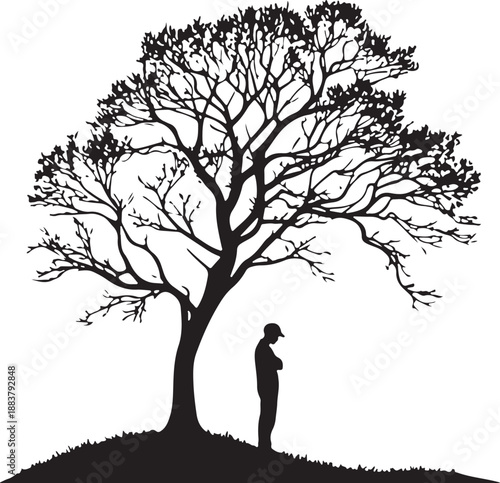 Silhouette of a lonely man standing under a bare tree on a hill