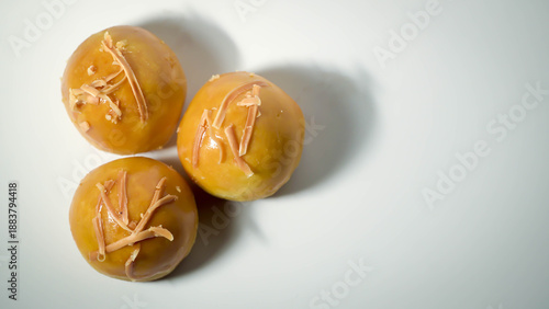 Detailed photo of nastar cake filled with pineapple cream and topped with sliced ​​cheese isolated on white background