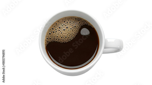 Overhead view of a white mug filled with dark coffee and foam