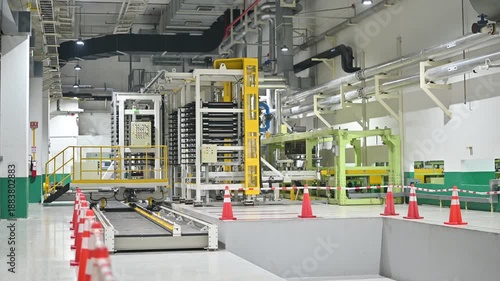 This image showcases a well-organized industrial space with safety cones lining a designated area, highlighting the importance of safety in manufacturing environments.