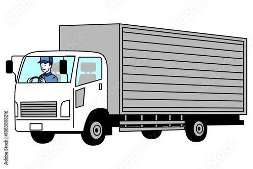 中型トラックを運転する配送ドライバー