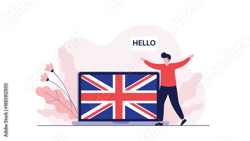 Man standing next to a laptop displaying the United Kingdom flag while saying hello in English for language learning.