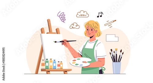 Young woman artist painting on canvas at easel with art supplies.