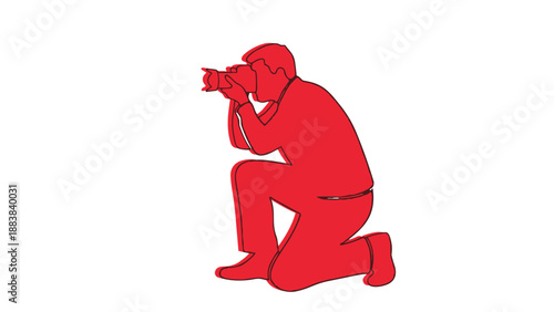 Red silhouette of a photographer kneeling while taking a picture