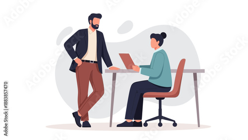 Business Meeting: Two colleagues collaborating at a desk with a laptop