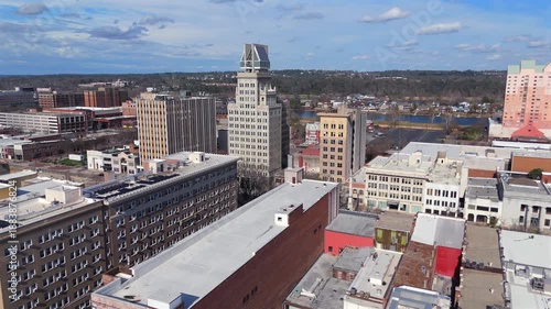 Aerial footage of Augusta skyline with historic buildings and sky
