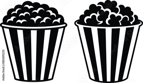 Two striped popcorn buckets filled with popcorn, a classic snack.