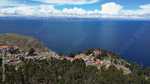 Isla del Sol, Bolivia: Aerial drone footage of the Yumani village in the Isla del sol on the lake titicaca in the Andes in the Bolivia. Shot with an orbit motion at the edge of the island with the jet