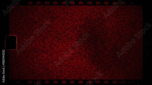 Vintage film grain and static overlay in deep red hues with evolving light patterns