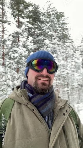 Winter Travel Blogger Recording Selfie Video in Forest