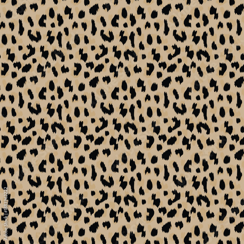 Classic leopard print seamless pattern featuring bold black spots on a warm beige background