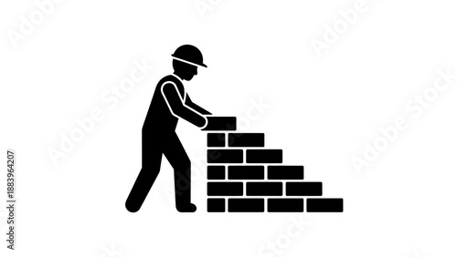 Construction worker building brick wall.
