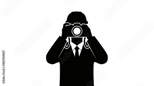 Silhouette of a man taking a picture with a camera.
