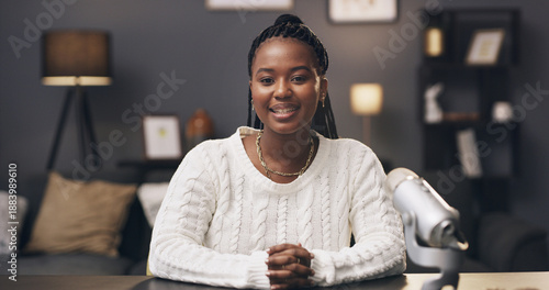 Photos Black woman, pov and influencer in home, smile and portrait with chat, mic and live streaming on web